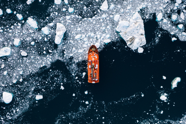 A ship sailing through fragmented ice.