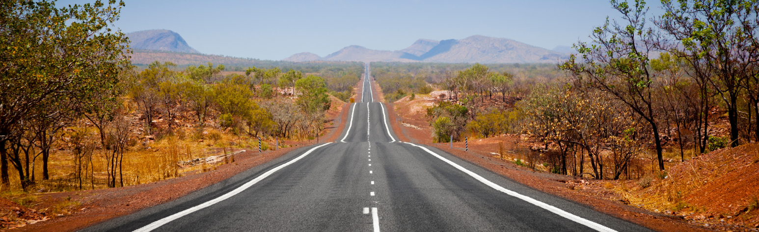 A straight road in the middle of the outback.